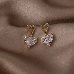 Double hearted gold and diamond earrings